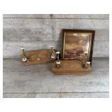 Coat hangers and framed picture