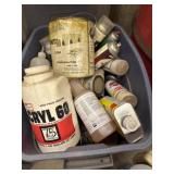 Tote full of paints and thinner