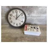 Clock and first aid kit