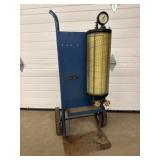 U-tube manometer with a yellowed chart,