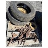 Skid of chain binders and 2 tires