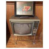 Vintage TV and stand with framed art