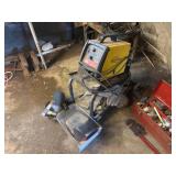 Welder, cart, and helmets