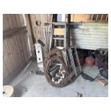 Wooden ladders, wreaths, and birdhouse