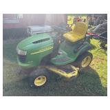 John Deere L120 mower with snow blade