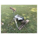 Saw, rolling stand, and motor