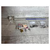 Watches, earrings, and glass coin block