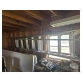 2 aluminum ladders and wooden ladder