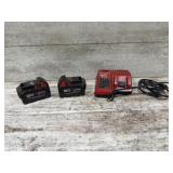 2 Milwaukee M18 5.0 batteries and charger