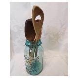 Ball mason jar with old wooden kitchen spoons