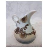 Nice creamer with gold overlay