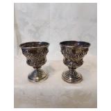 Pair of small silver plate stems , four inches