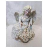 Cer.\nAmic angel with the baby jesus , seven