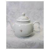 Sweet personal teapot with flower decoration
