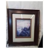 Framed landscape print with a cross fourteen by