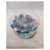 Container of marbles including a shooter