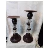 Pair of graduated size pillar candleholders
