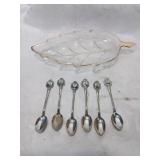 Six german silver plate demeatos , spoons in a