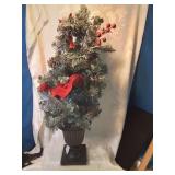 Holiday tree lights up twenty eight inches