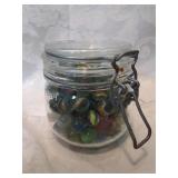 Jar of marbles including a ruby shooter