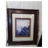 Framed landscape print with a cross fourteen by