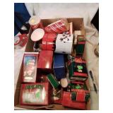 Box of christmas decorations with many hallmark