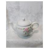 Sweet ceramic teapot with flowers