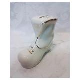 Ceramic shoe bank with coins , souvenir of p