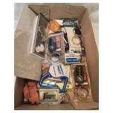 Flat of many advertising keychains