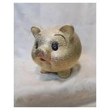 Is large gold piggy bank