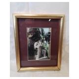 Gold framed photo of a walkway nine by eleven