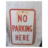 Vintage metal no parking here sign