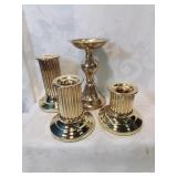 Group of four brass candle holders