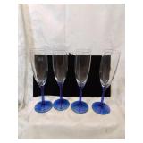 Set a four cobalt to clear champagne flutes
