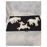 Group of three ceramic lamb wall hangers