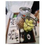 Flat of golf balls and tees