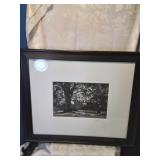 Black and white photograph framed and signed by