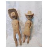 Carved wooden cow people figures thirteen inches