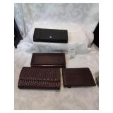 Group of four leather ladies wallets
