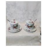 Matching ceramic jam pots with spoons