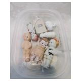 Container of small vintage dolls and other items