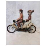 Vintage plastic wall hanger couple on bicycle