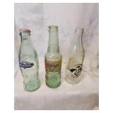 Three vintage soda bottles