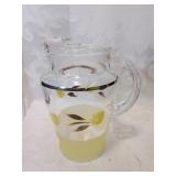 Glass pitcher with tulips