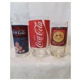 Two coke and a burger king glass