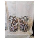 Pair of figural vase and candle holders as found