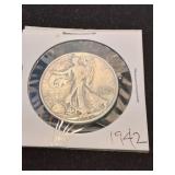 Ninet.\nEen 42.\nSilver half dollar