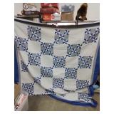 Large.\nBlue and white quilt