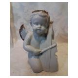 Ceramic angel playing instrument six inches