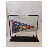 Framed vintage pennant in stand